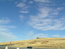 [House and Clouds, East of the Rest Stop]