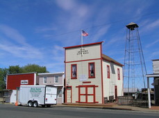 [The Fire Department. Note the working fire bell next door.]