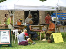 [People playing music at the Saturday Farmers' Market]