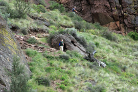 [Woman Investigating Sniper Hole Rock]